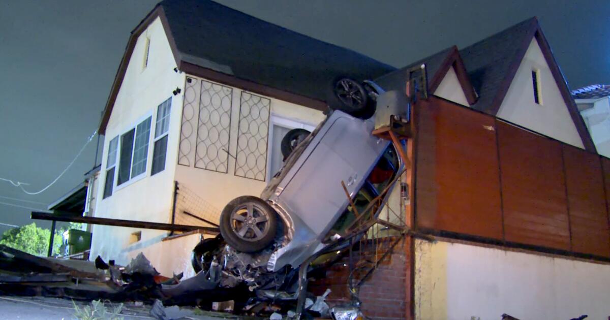 Car flips, winds up vertical on the porch of an L.A. home