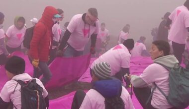 Volunteer to set up San Francisco's Pink Triangle for Pride month