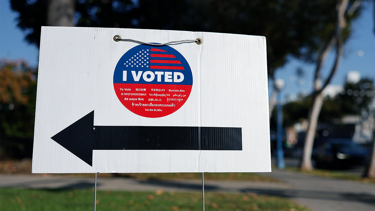 A sign pointing to a vote center during early voting in West Hollywood, Calif.