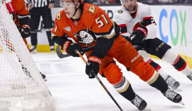 ANAHEIM, CALIFORNIA - DECEMBER 1: Olen Zellweger #51 of the Anaheim Ducks skates past Michael Amadio #22 of the Ottawa Senators during the third period of a game at Honda Center on December 1, 2024 in Anaheim, California.