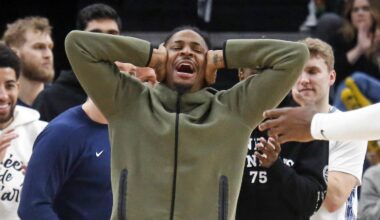 Feb 2, 2026; Memphis, Tennessee, USA; Memphis Grizzlies guard Ja Morant (12) reacts with forward/center Jaren Jackson Jr. (8) after a basket during the fourth quarter against the Minnesota Timberwolves at FedExForum. Mandatory Credit: Petre Thomas-Imagn Images