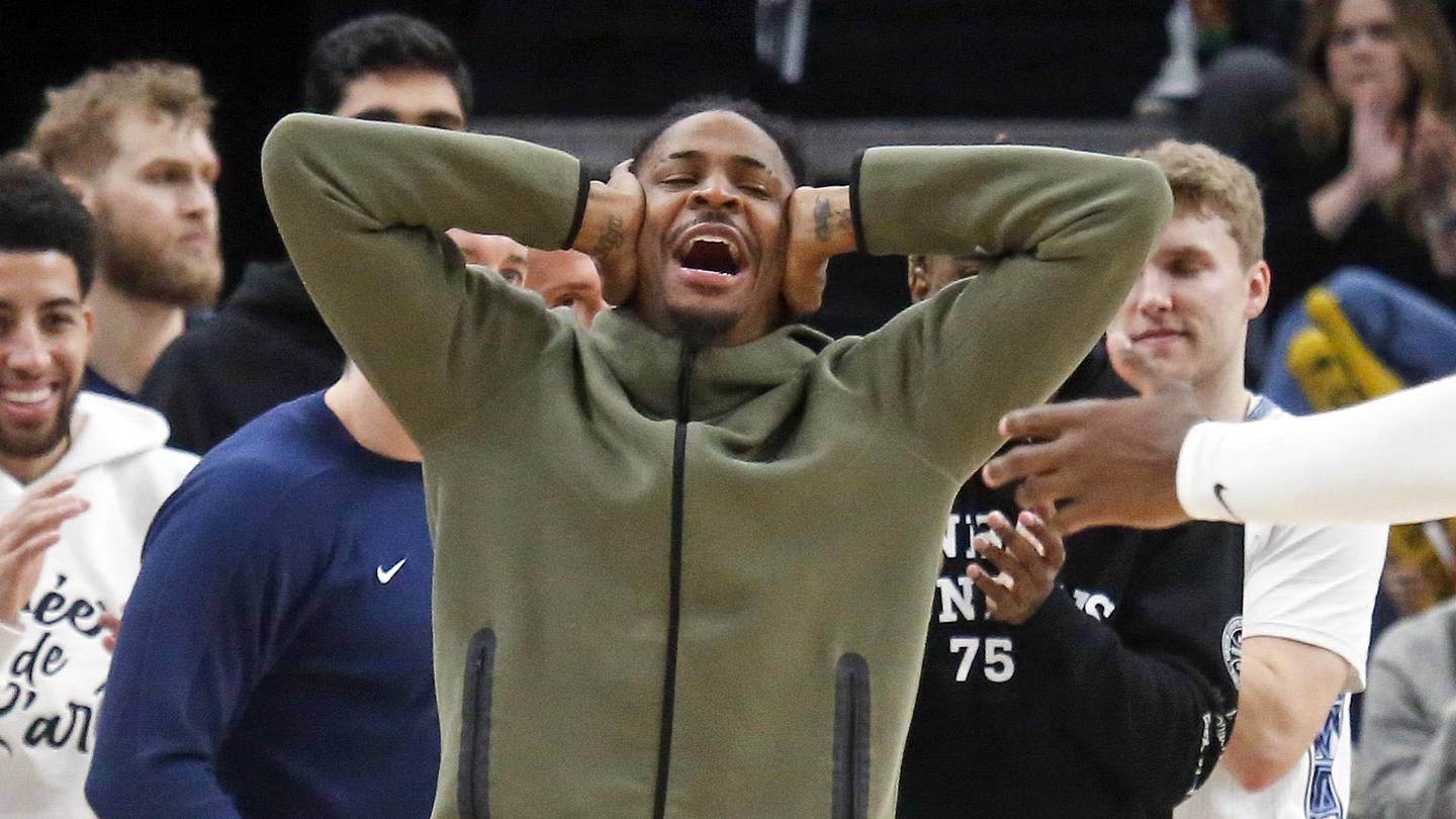 Feb 2, 2026; Memphis, Tennessee, USA; Memphis Grizzlies guard Ja Morant (12) reacts with forward/center Jaren Jackson Jr. (8) after a basket during the fourth quarter against the Minnesota Timberwolves at FedExForum. Mandatory Credit: Petre Thomas-Imagn Images