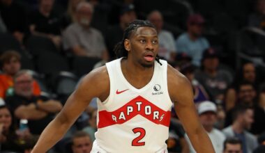 Mar 22, 2026; Phoenix, Arizona, USA; Toronto Raptors forward Jonathan Mogbo (2) dribbles against Phoenix Suns guard Jamaree Bouyea (17) during the fourth quarter at Mortgage Matchup Center. Mandatory Credit: Anna Carrington-Imagn Images