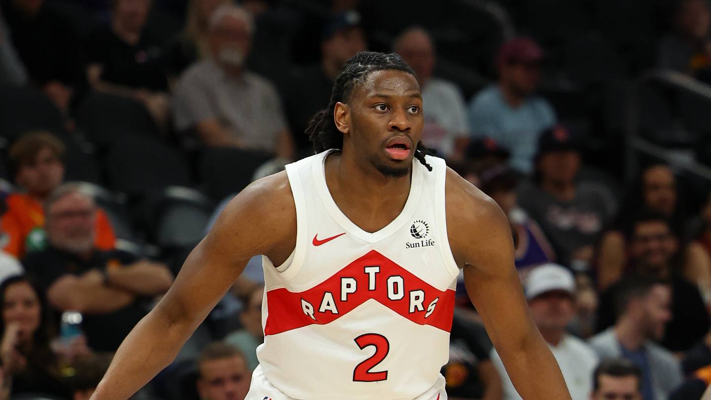 Mar 22, 2026; Phoenix, Arizona, USA; Toronto Raptors forward Jonathan Mogbo (2) dribbles against Phoenix Suns guard Jamaree Bouyea (17) during the fourth quarter at Mortgage Matchup Center. Mandatory Credit: Anna Carrington-Imagn Images