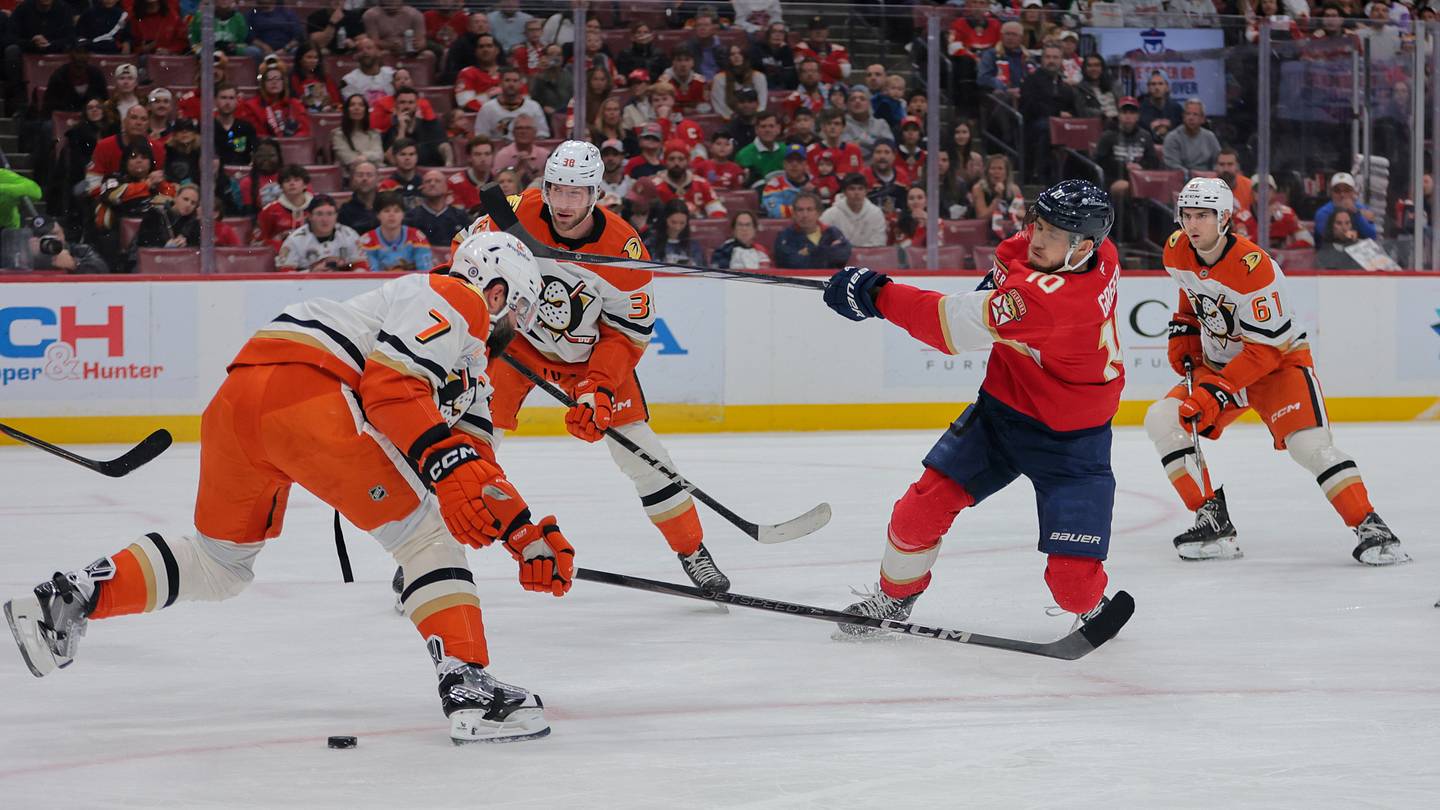 Jan 18, 2025; Sunrise, Florida, USA; Florida Panthers left wing A.J. Greer (10) shoots the puck against the Anaheim Ducks during the first period at Amerant Bank Arena. Mandatory Credit: Sam Navarro-Imagn Images