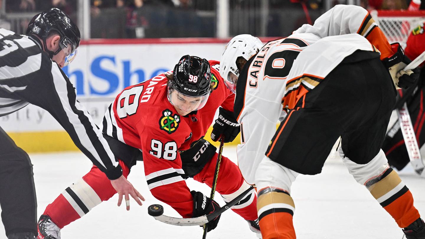 Dec 7, 2023; Chicago, Illinois, USA; Chicago Blackhawks forward Connor Bedard (98) takes a face off against Anaheim Ducks forward Leo Carlsson (91) in the second period at United Center. Mandatory Credit: Jamie Sabau-USA TODAY Sports