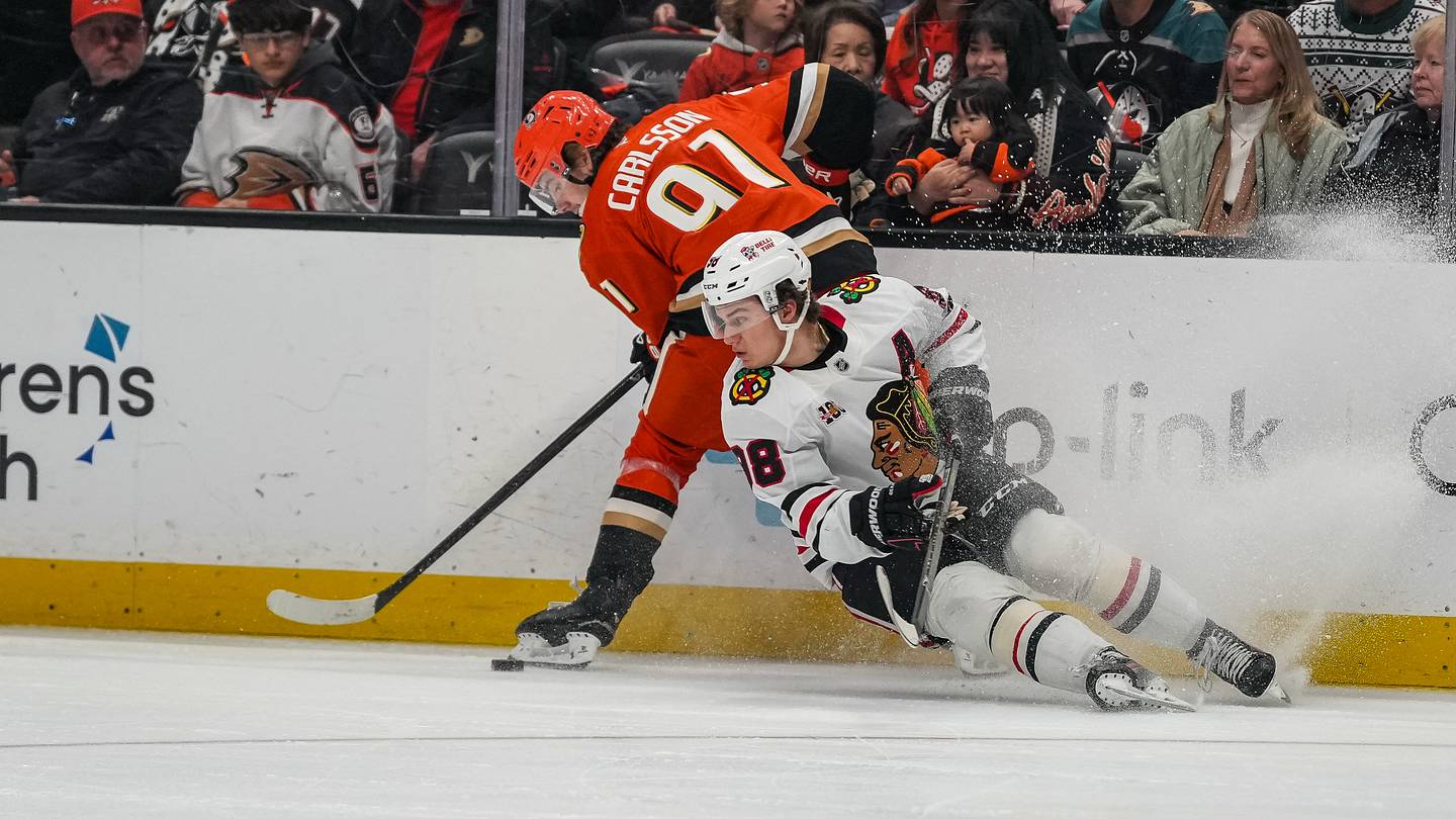 Dec 7, 2025; Anaheim, California, USA;  Anaheim Ducks center Leo Carlsson (91) defends against Chicago Blackhawks center Connor Bedard (98) during the first period at Honda Center. Mandatory Credit: Corinne Votaw-Imagn Images