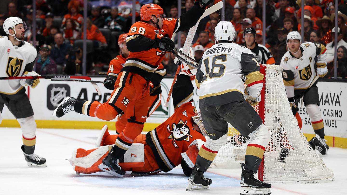 May 14, 2026; Anaheim, California, USA;  Anaheim Ducks defenseman Pavel Mintyukov (98) clears the puck with his hand during the first period against the Vegas Golden Knights in game six of the second round of the 2026 Stanley Cup Playoffs at Honda Center. Mandatory Credit: Kiyoshi Mio-Imagn Images