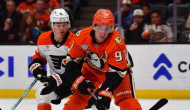 Mar 18, 2026; Anaheim, California, USA; Anaheim Ducks center Leo Carlsson (91) moves in for a shot as Philadelphia Flyers defenseman Cam York (8) and center Trevor Zegras (46) help goaltender Dan Vladar (80) defend the goal during the overtime period at Honda Center. Mandatory Credit: Gary A. Vasquez-Imagn Images