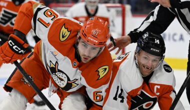 Jan 6, 2026; Philadelphia, Pennsylvania, USA; Anaheim Ducks left wing Cutter Gauthier (61) and Philadelphia Flyers center Sean Couturier (14) battle after a face-off during the first period at Xfinity Mobile Arena. Mandatory Credit: Eric Hartline-Imagn Images