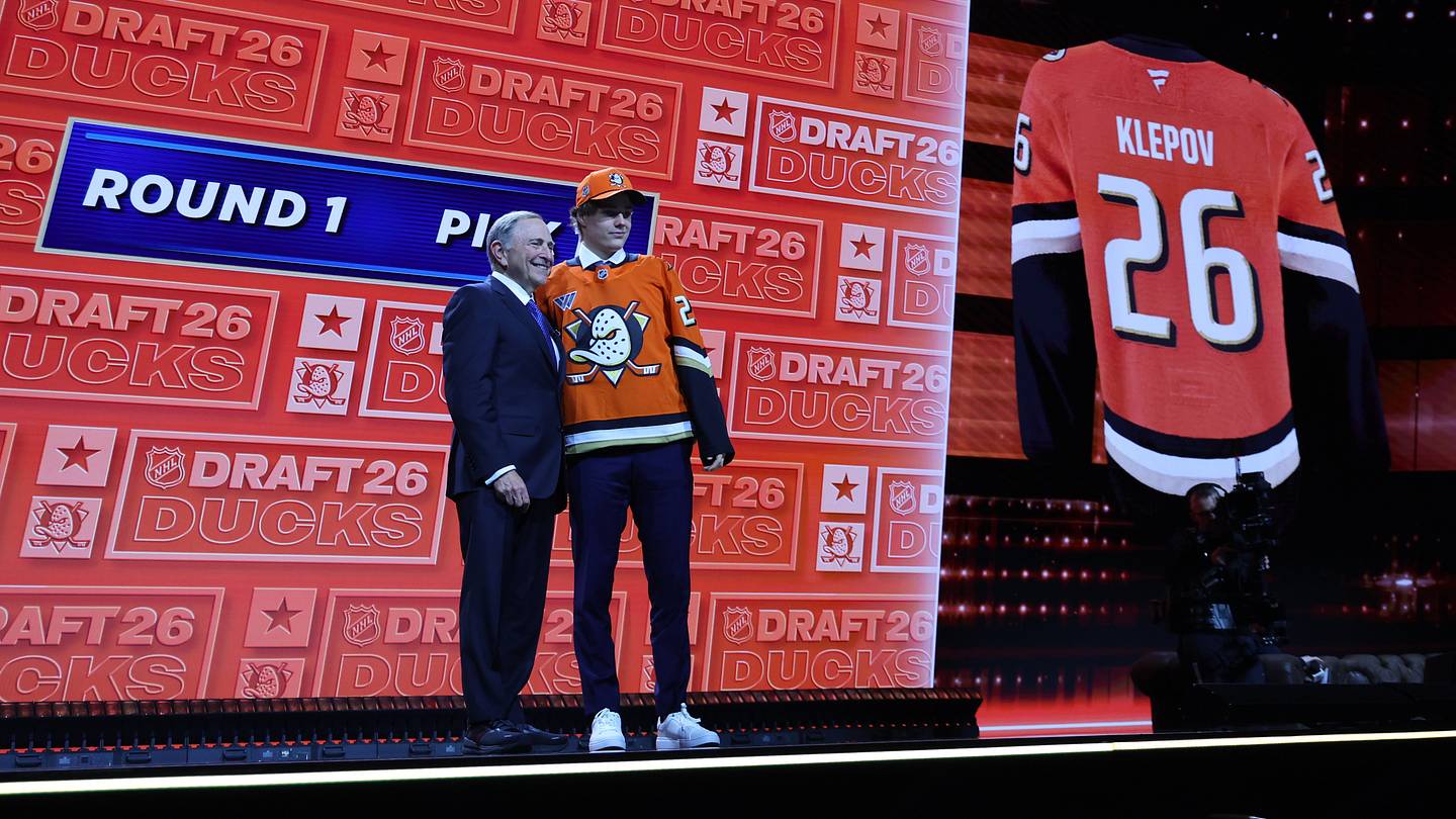 Jun 26, 2026; Buffalo, New York, USA; Nikita Klepov reacts beside NHL commissioner Gary Bettman after being selected with the fifteenth pick in the first round of the 2026 NHL Draft by the Anaheim Ducks at KeyBank Center. Mandatory Credit: Timothy T. Ludwig-Imagn Images