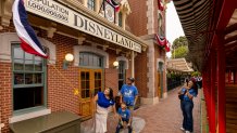 A historic milestone is made at Disneyland Resort in Anaheim, Calif., on Friday, July 3, 2026; The Happiest Place on Earth commemorates welcoming one billion guests to Disneyland park and Disney California Adventure park. The honorary one billionth guest, Andres Robles, 8, and his parents join Disney Ambassador Oralia Neria Felix to unveil an updated sign at Disneyland park that reads “Population 1,000,000,000”. (Christian Thompson/Disneyland Resort)