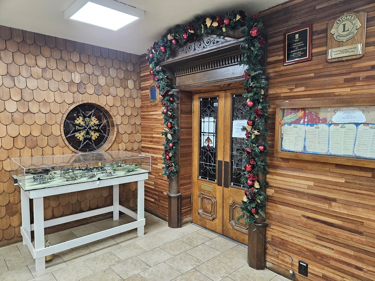 The locked door of Aviator's Restaurant is surrounded by holiday decorations Monday, July 20, 2026 at Sacramento Executive Airport in Land Park.