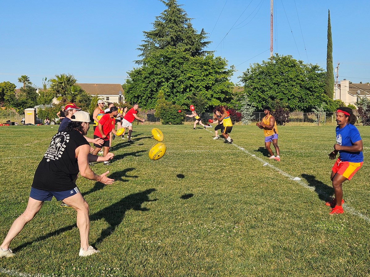 Matt “Freddy” Frederickson (left), Julian “Peacock” David (right) and other Sacramento Suns players practice their handballs on Wednesday, April 29, 2026 at Airfield Park in Natomas.