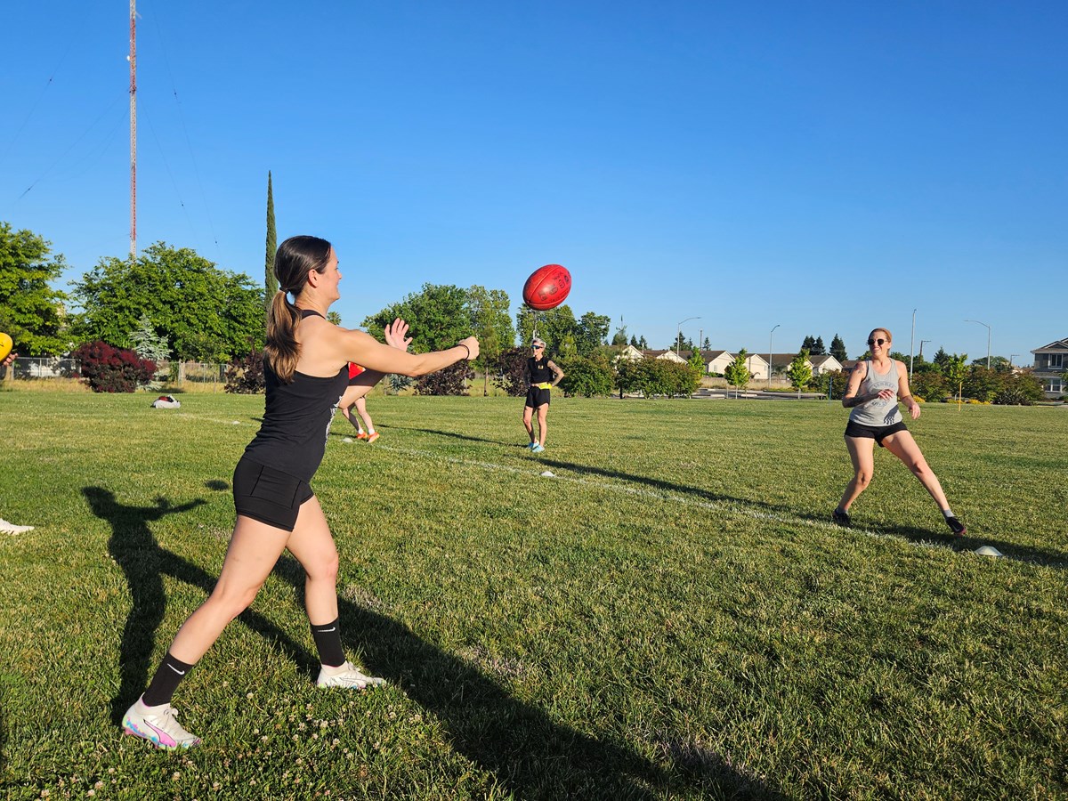 Vanessa Goh (left) passes the ball to Jess Leahy (right) during a Sacramento Suns practice on on Wednesday, April 29, 2026 at Airfield Park in Natomas.