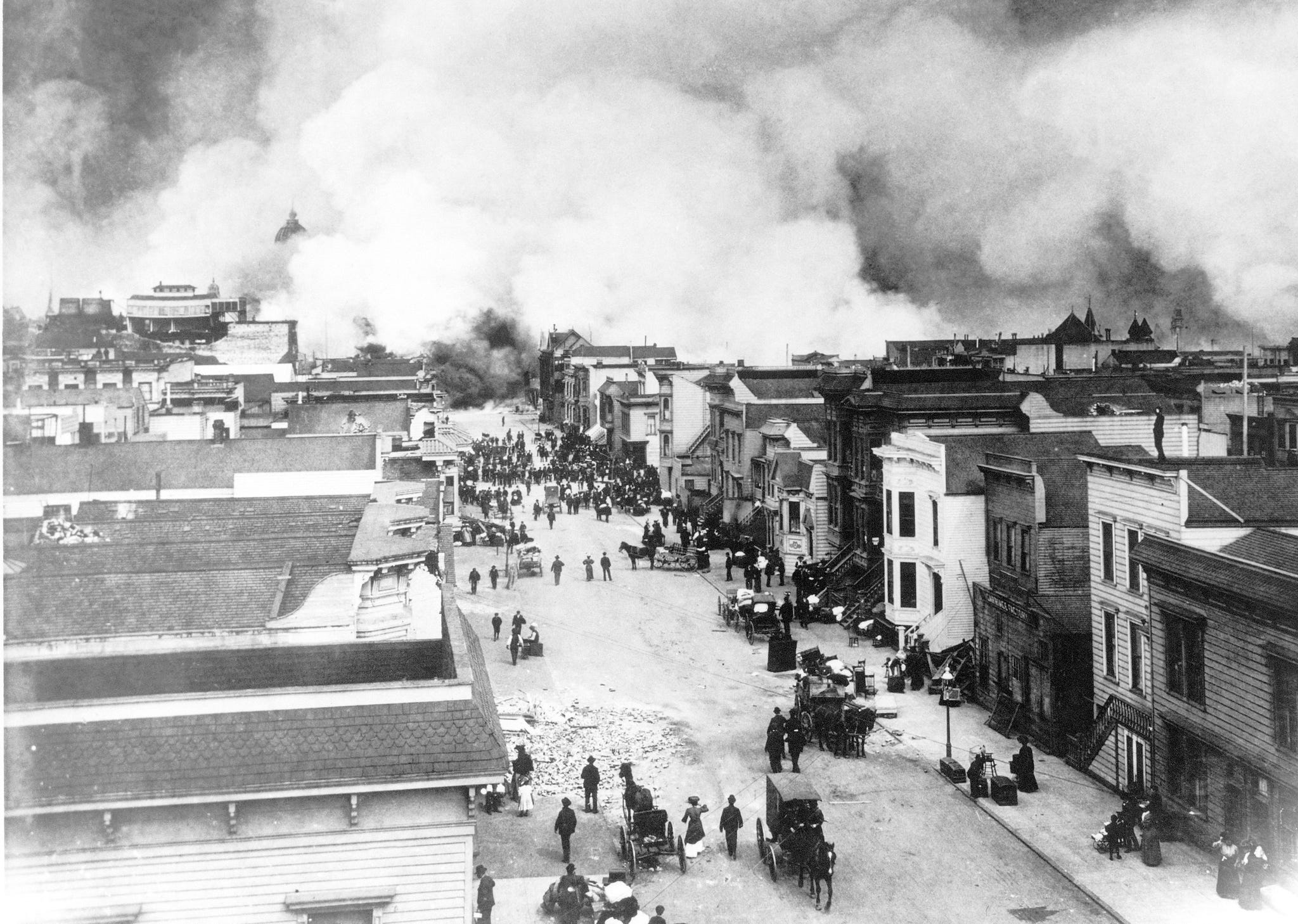 close up view of refugees as they flee along grove street from the socalled 'ham  eggs' fire, san francisco, california, april 18, 1906 this fire started in a house on the south side of hayes street when, around 9am, a woman attempted to make breakfast on her stove, the chimney for which had been damaged in the massive earthquake this fire burned more territory than any other single fire, and as all fire departments were engaged elsewhere, the fire spread out of control reaching gough and grove streets, eventually causing the destruction of the mission district as well as the hayes valley section, including the mechanics' pavilion and the city hall photo by photoquestgetty images