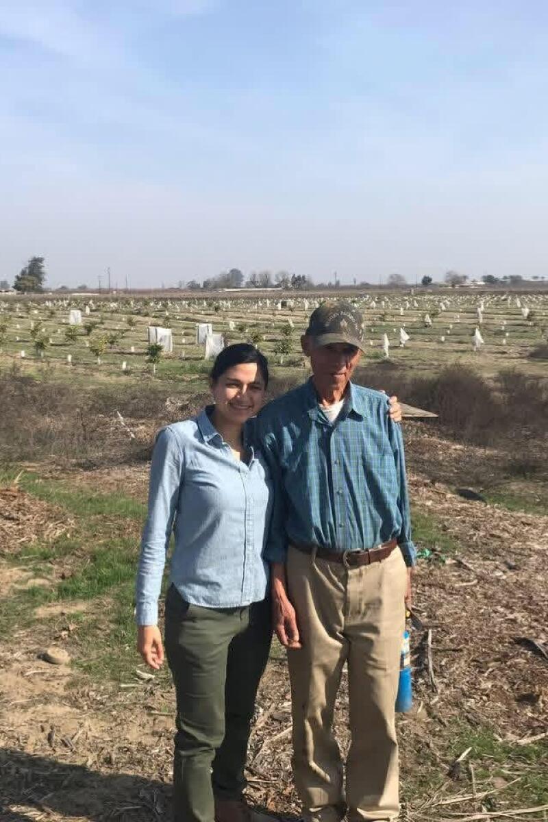 Jessica Gonzalez and her father Salvador on their family farm in Merced.