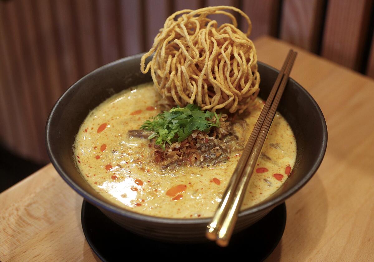 The colorful khao soi noodle with braised beef at the traditional Thai comfort food restaurant Manaao in Tustin.