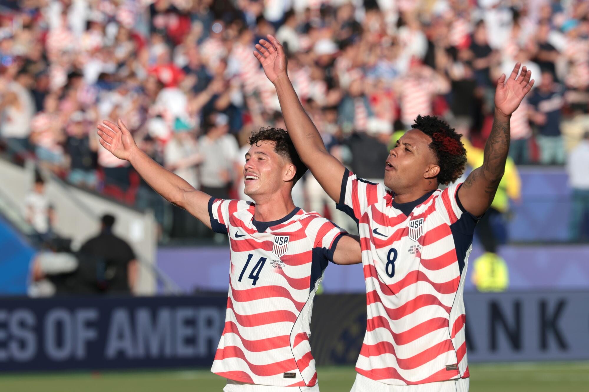 U.S. midfielders Sebastian Berhalter and Weston McKennie sings "Country Road" along with fans.