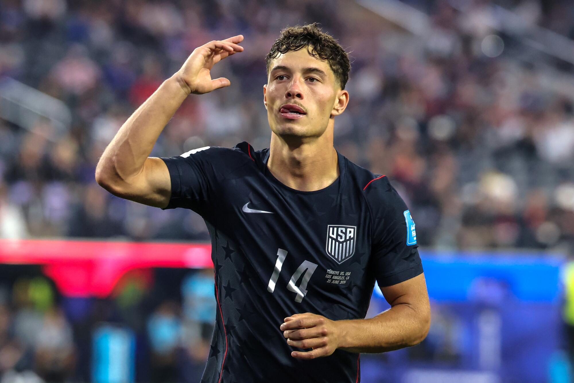 U.S. midfielder Sebastian Berhalter waves to the crowd during his team's World Cup match against Turkey at SoFi Stadium.