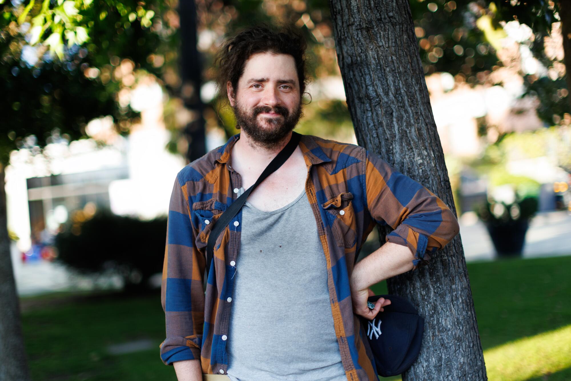 A person stands near his shop in Silverlake.