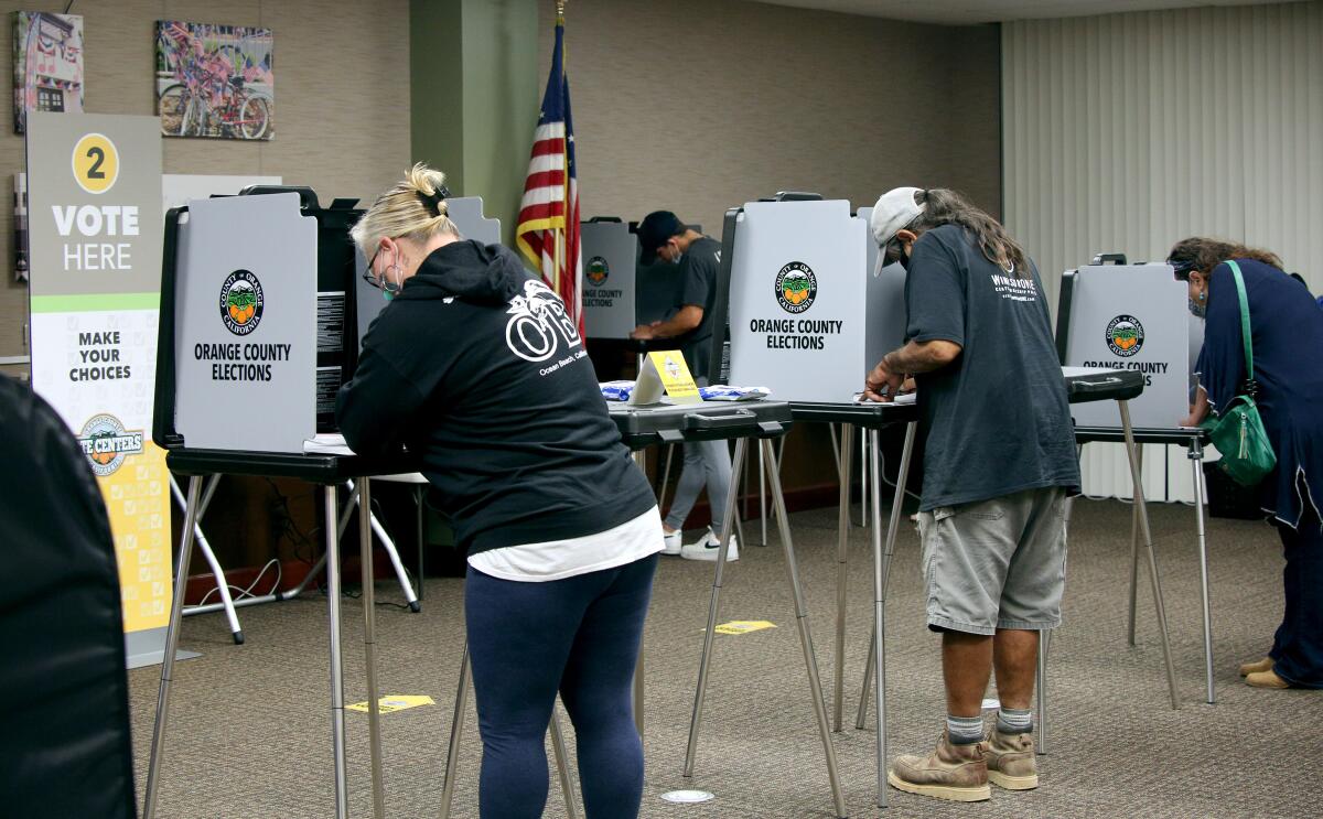 Voters cast their ballot at the Civic Center polling location, in Huntington Beach in 2020.