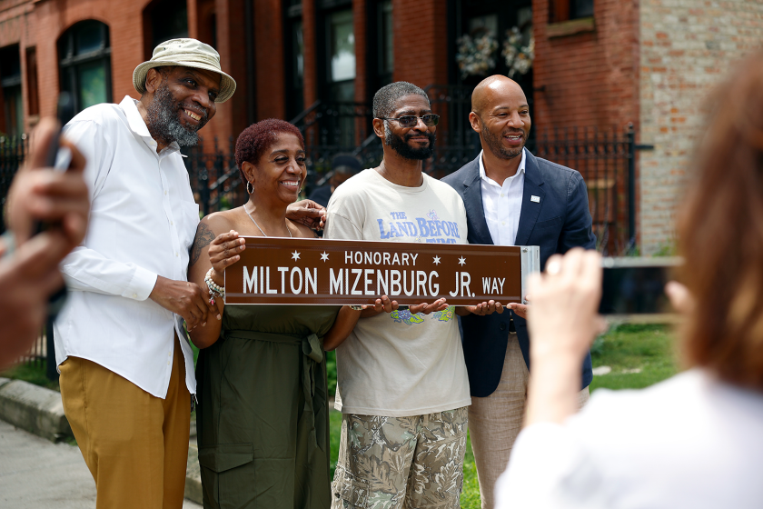 From left, David Mizenburg, Laura Barnes and Milton Mizenburg III pose with Alderman Lamont Robinson and the new street sign honoring Milton Mizenburg Jr. on Saturday, June 27, 2026, at Oakland Museum and Garden in Oakland.