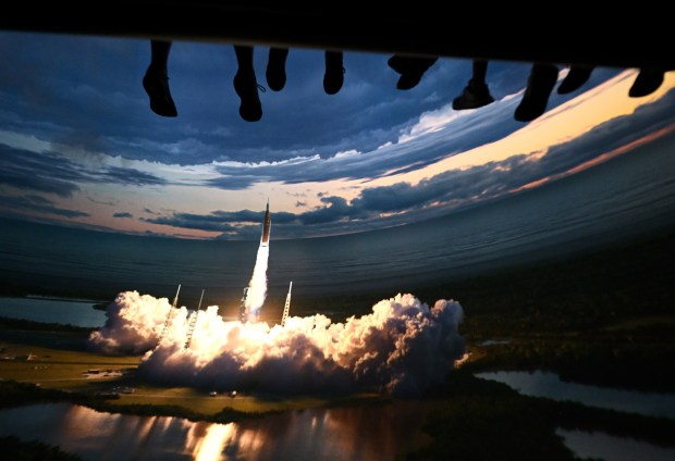 A Riders watch as a NASA Space Launch System (SLS) rocket lifts off from Kennedy Space Center's Pad 39B during opening day of Soarin' Across America at Disney California Adventure in Anaheim on Thursday, July 2, 2026. The patriotic nod to the United States' Semiquincentennial temporary replaces Soarin' over the World. (Photo by Jeff Gritchen, Orange County Register/SCNG)