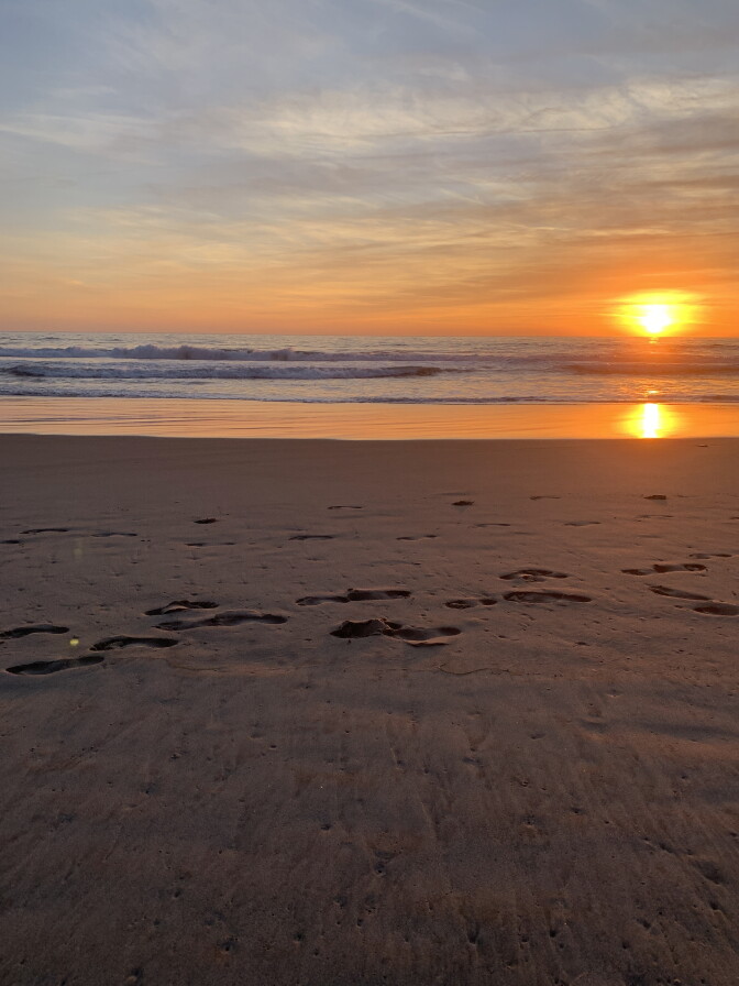 A picturesque beach at sunset.