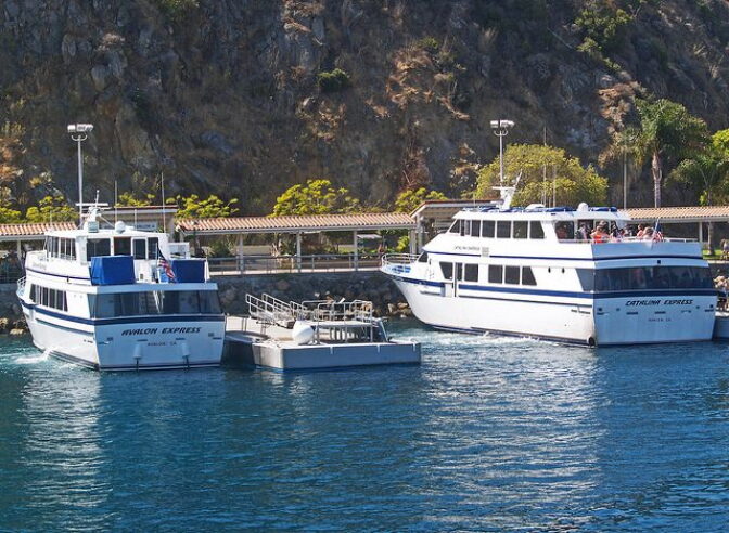 Two boats docked in a harbor off the coast of Catalina Island.
