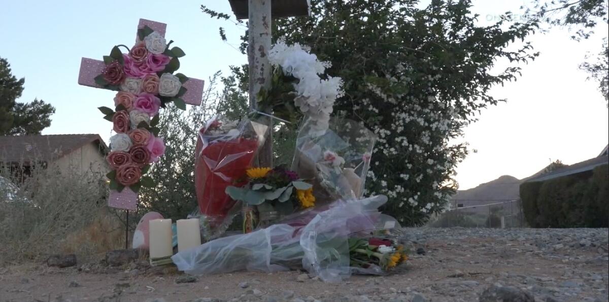 A makeshift memorial was created at the site of a crash in Apple Valley that killed a woman and her unborn twins.