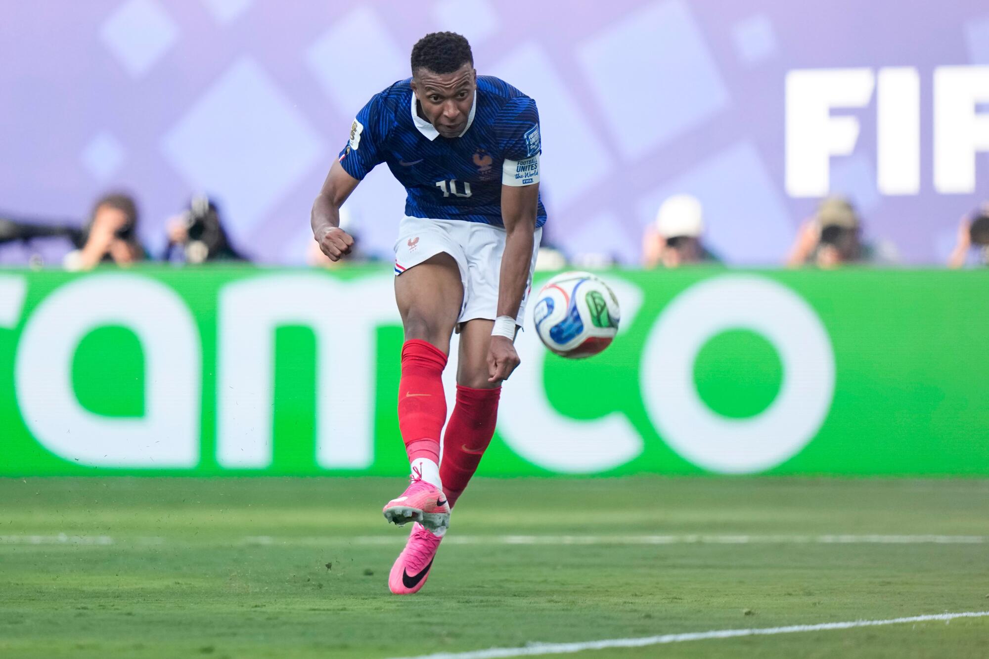 France's Kylian Mbappé scores against Sweden on June 30.