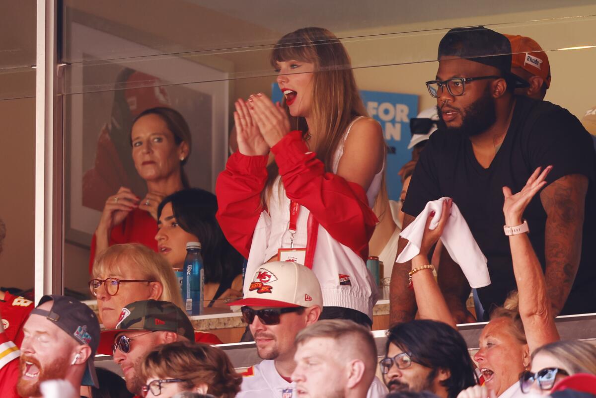 Taylor Swift watching a game