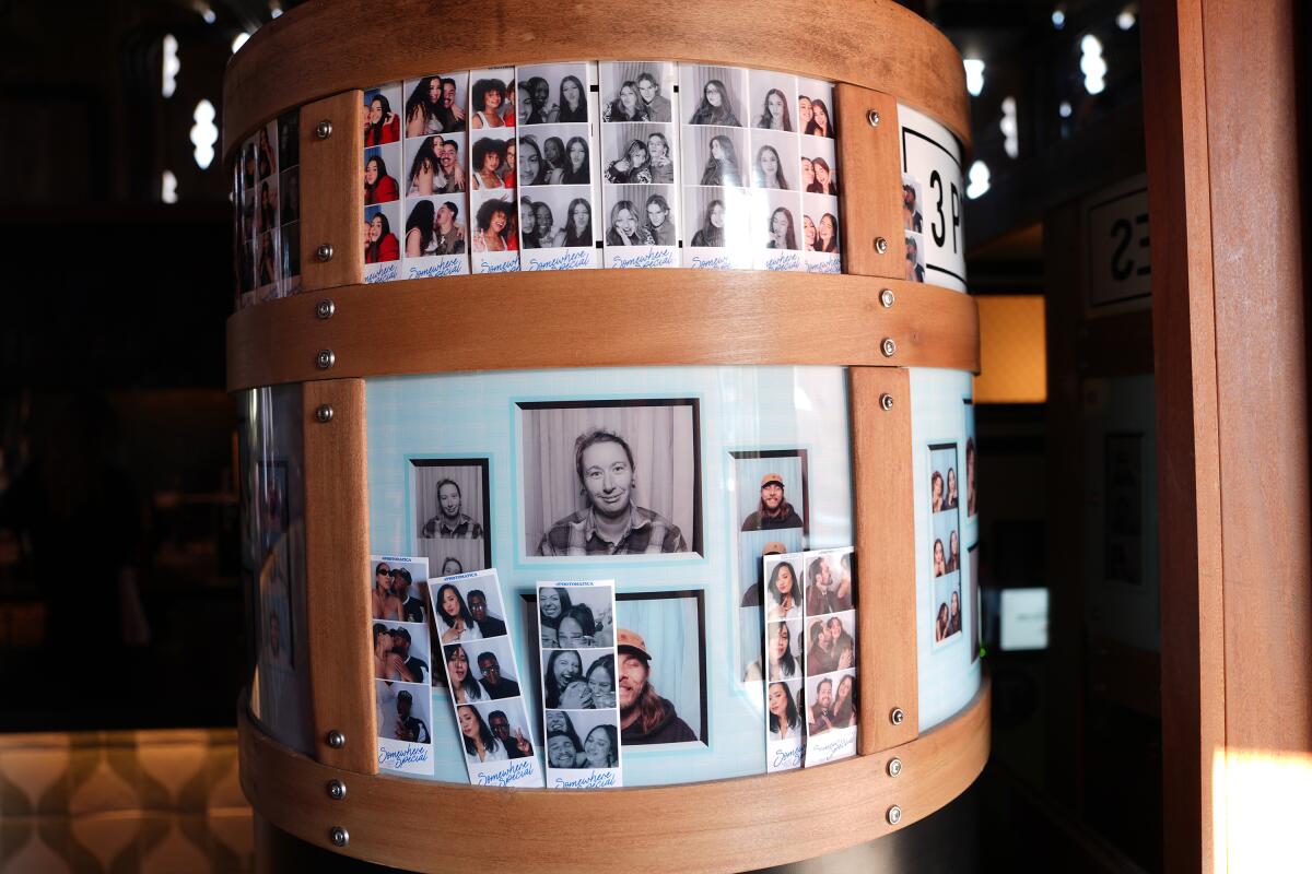 Photo booth photos at the rooftop bar.