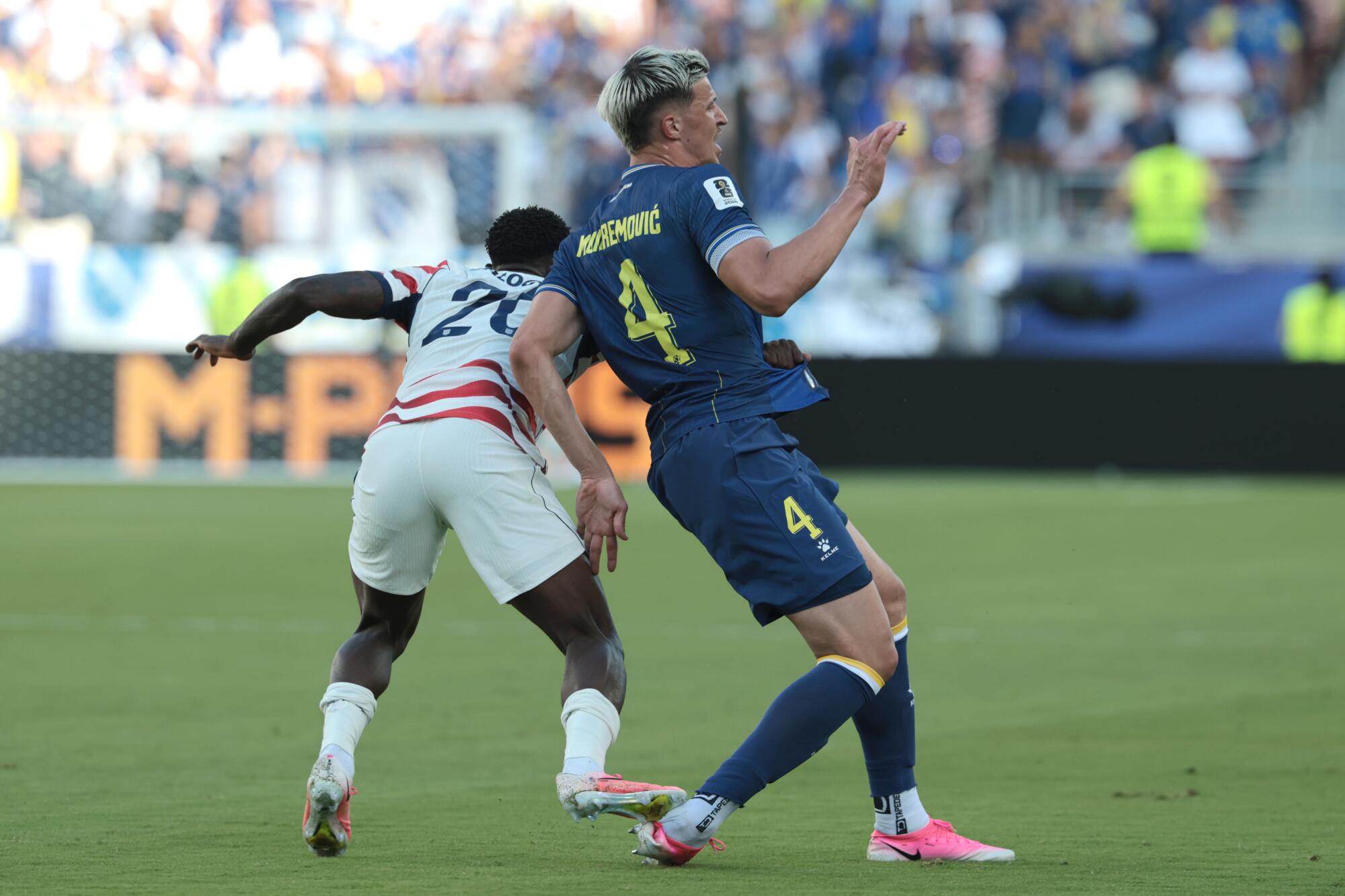 U.S. forward Folarin Balogun steps on Bosnia-Herzegovina defender Tarik Muharemovic's foot and received a red card.