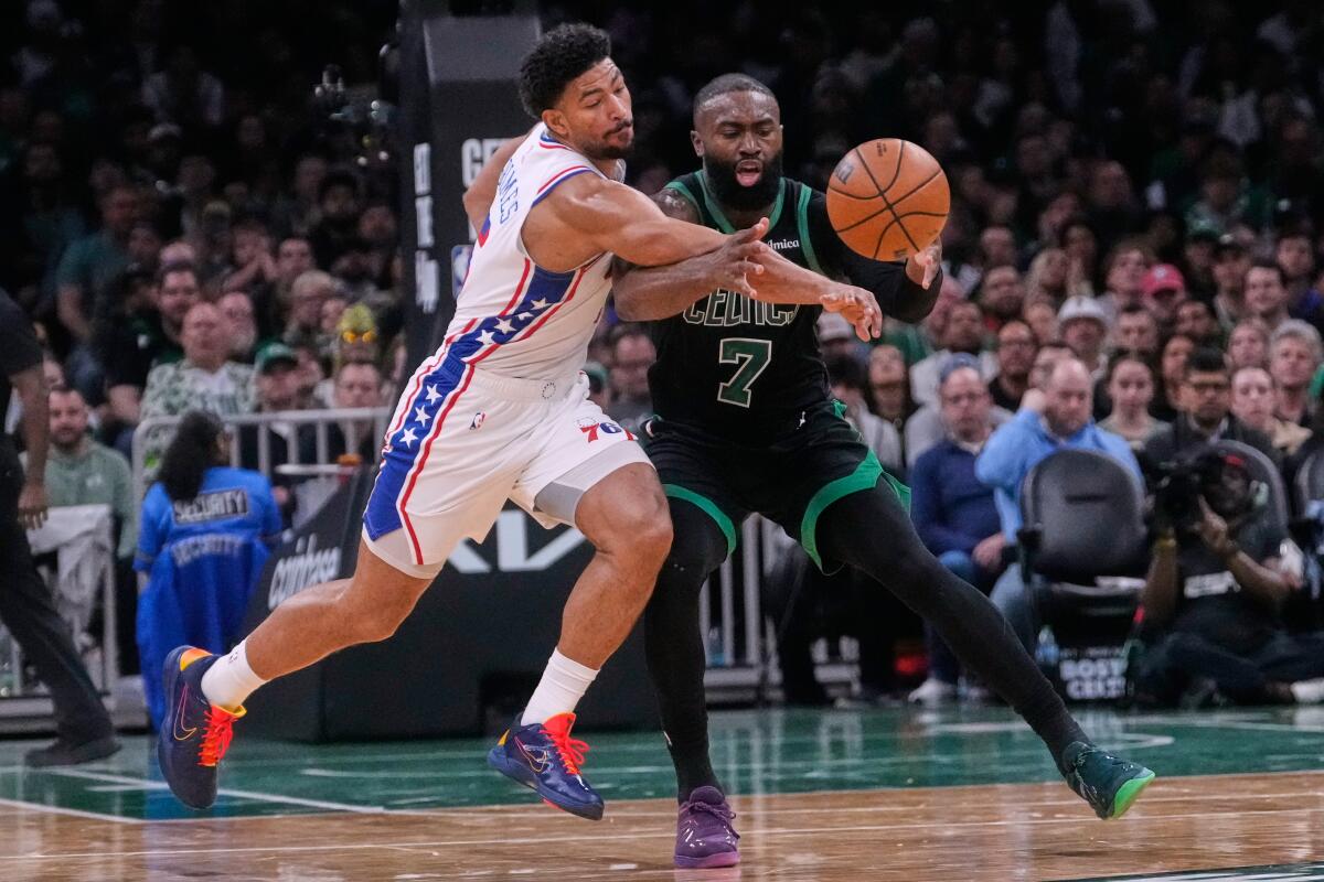 Philadelphia guard Quentin Grimes, left, knocks the ball from the grasp of Boston guard Jaylen Brown during a playoff game.