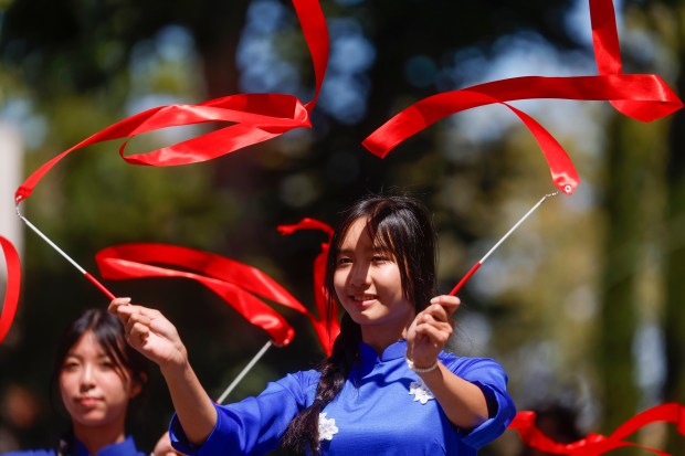 Monika Tactay, 15, of San Jose, waves streamers during the RW&B Parade along The Alameda in San Jose, Calif., on Saturday, July 4, 2026. (Shae Hammond/Bay Area News Group)