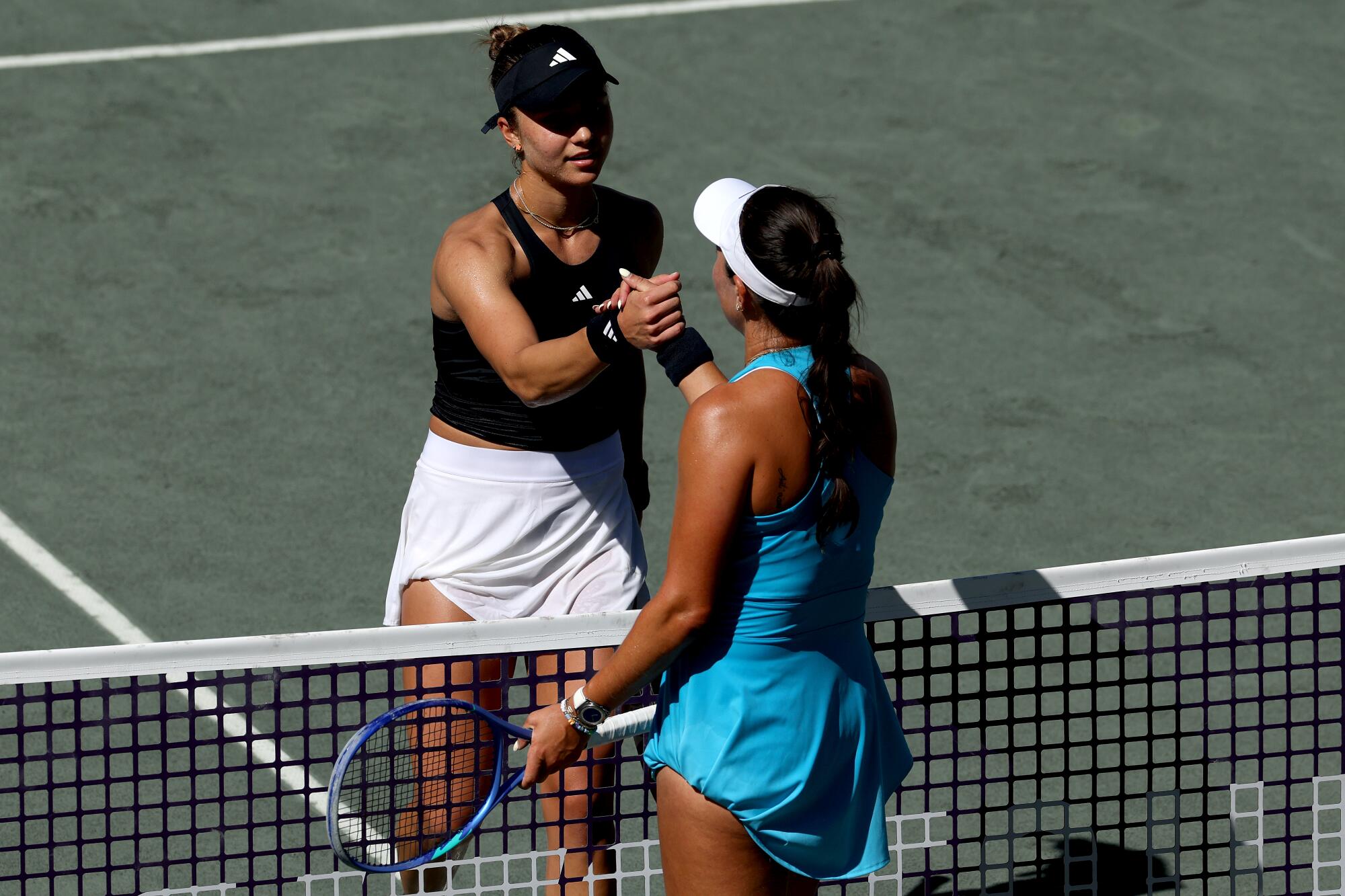 Torrance native Iva Jovic congratulates fellow American Jessica Pegula after Pegula won their match.