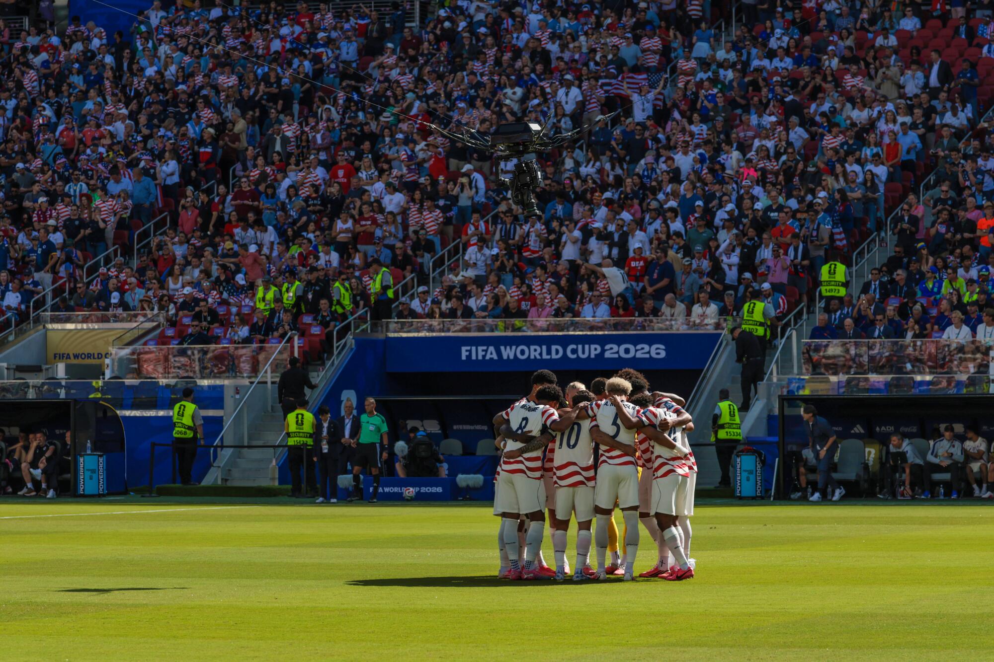 U.S. players huddle seconds before playing Bosnia-Herzegovina during a World Cup knockout round match at Levi's Stadium.