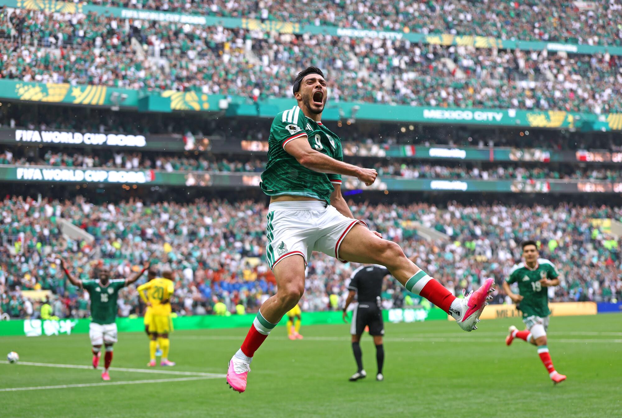 Mexico's Raúl Jiménez celebrates after scoring against South Africa during a World Cup match at Azteca Stadium.
