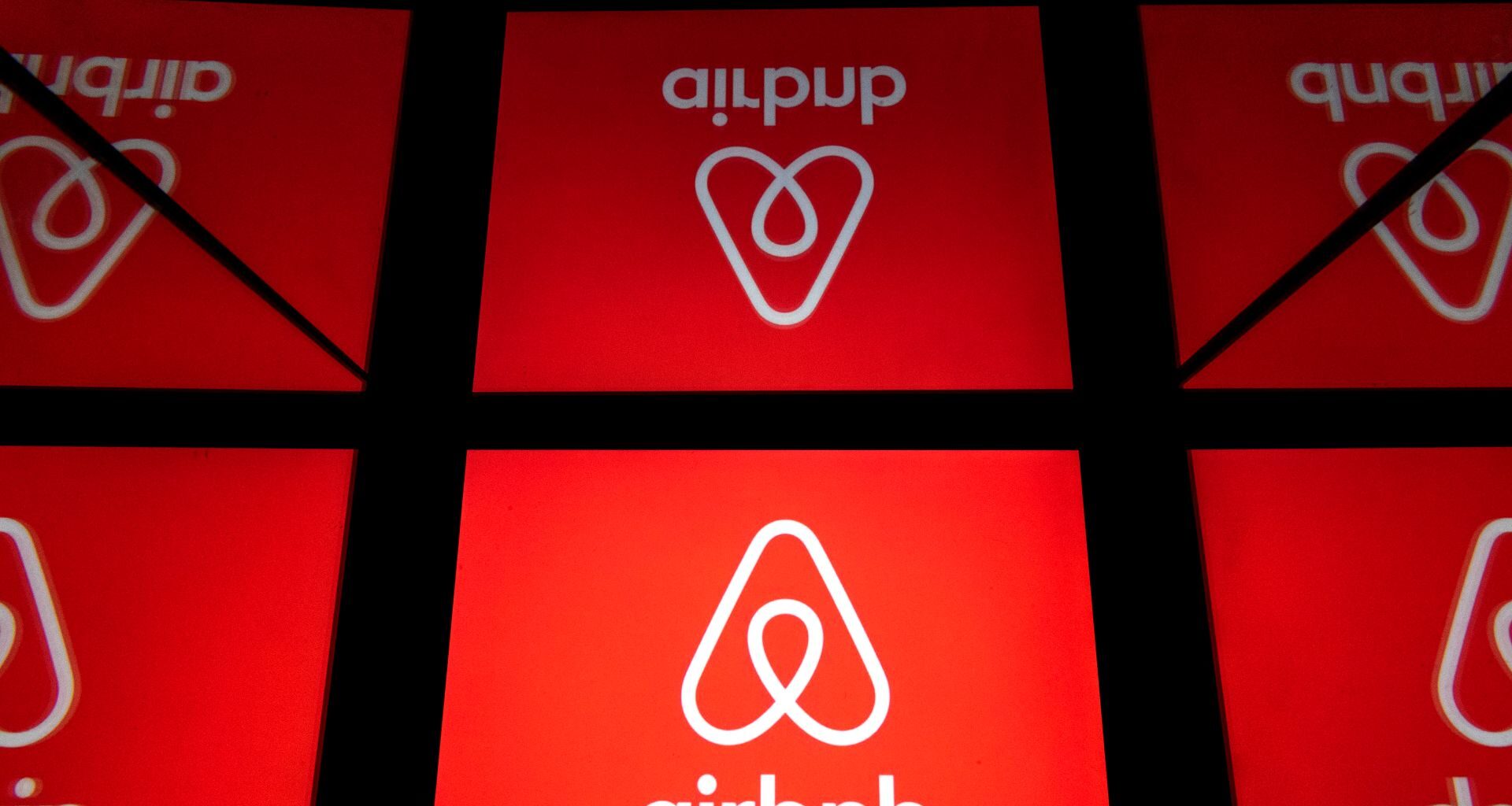 Multiple red panels displaying the Airbnb logo.