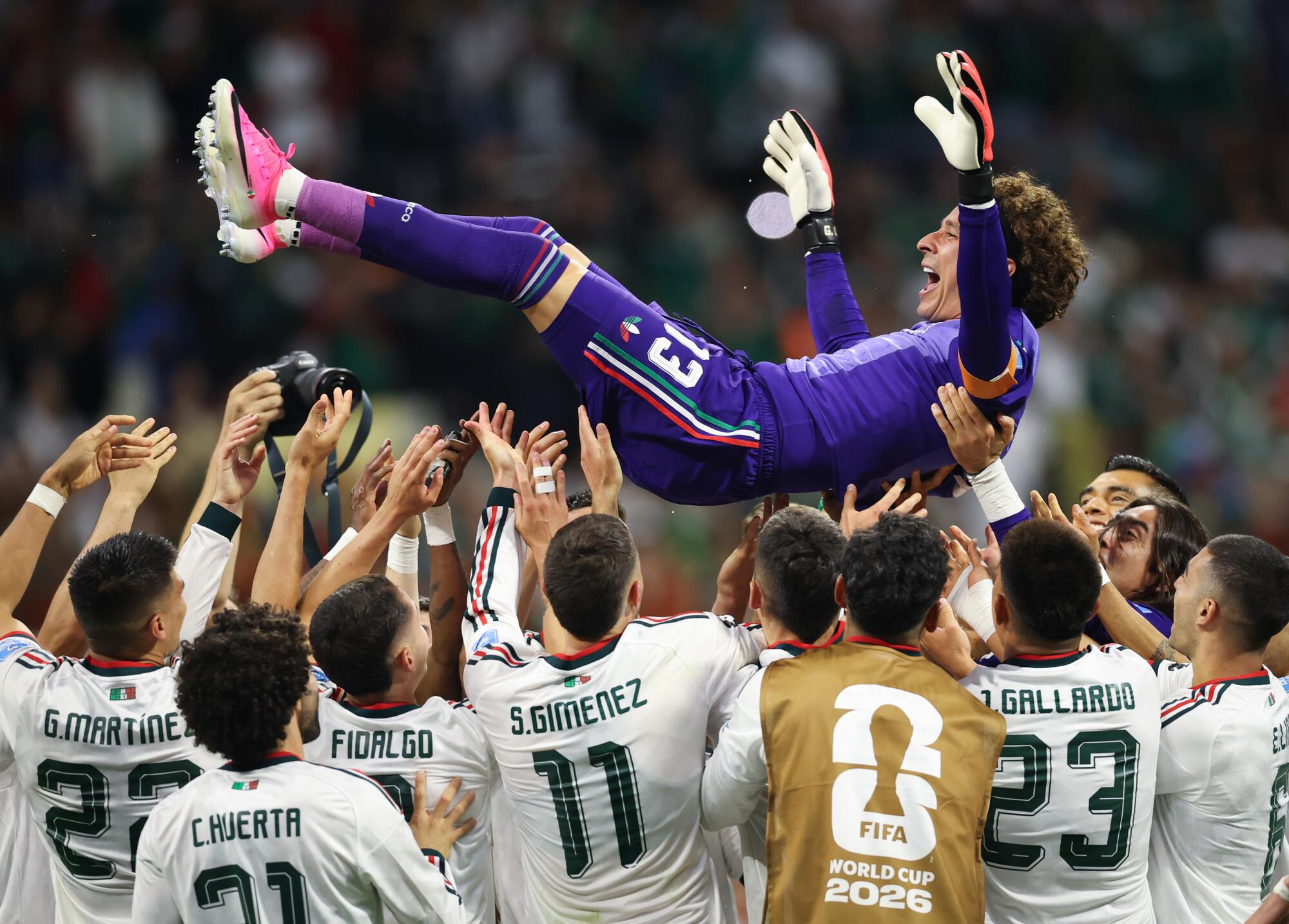 Veteran Mexico goalkeeper Guillermo Ochoa is tossed into the air by teammates after their World Cup win over Czechia.