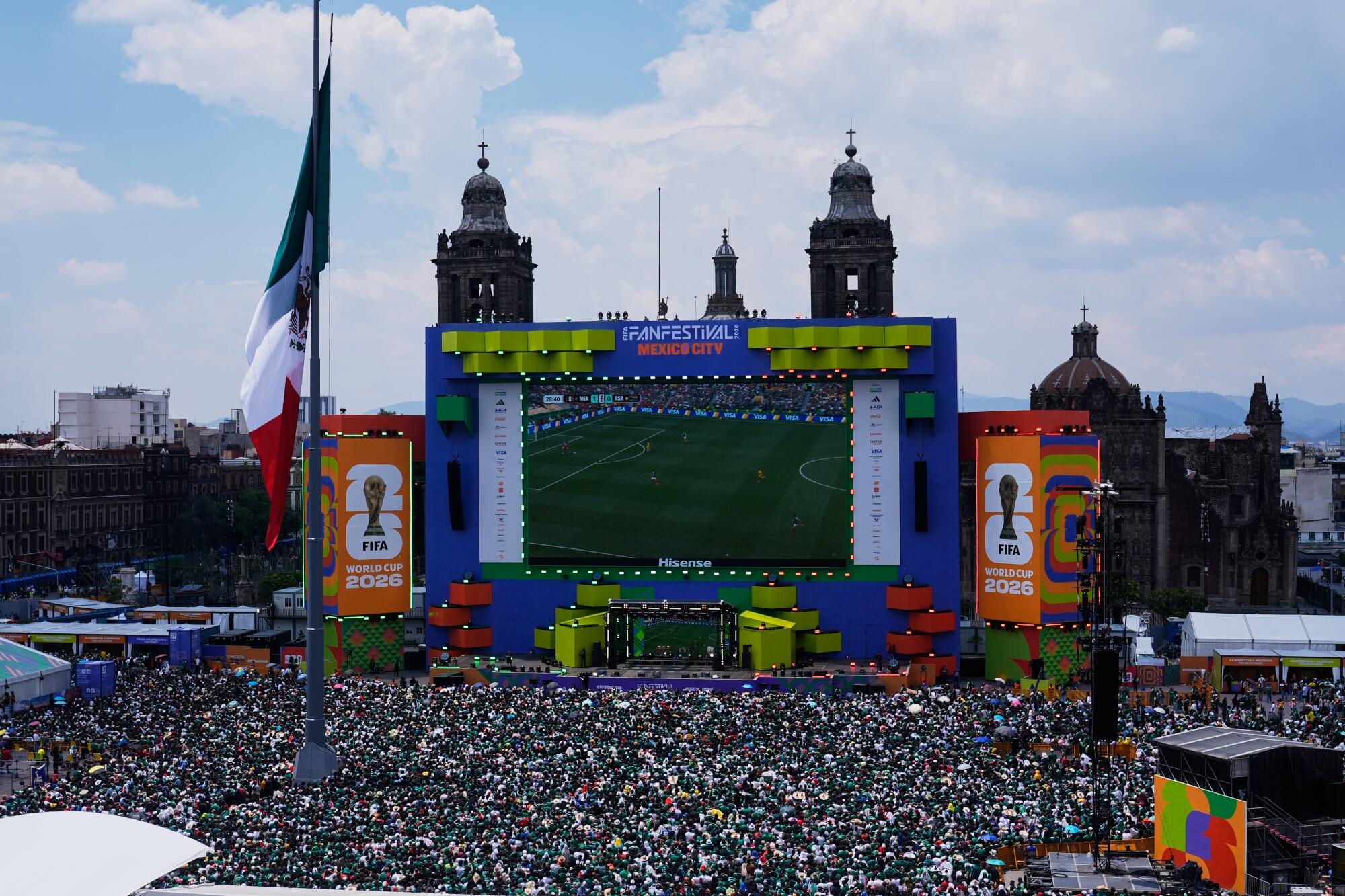 Fans watch the opening match of the World Cup between Mexico and South Africa at a fan festival in the Zocalo.