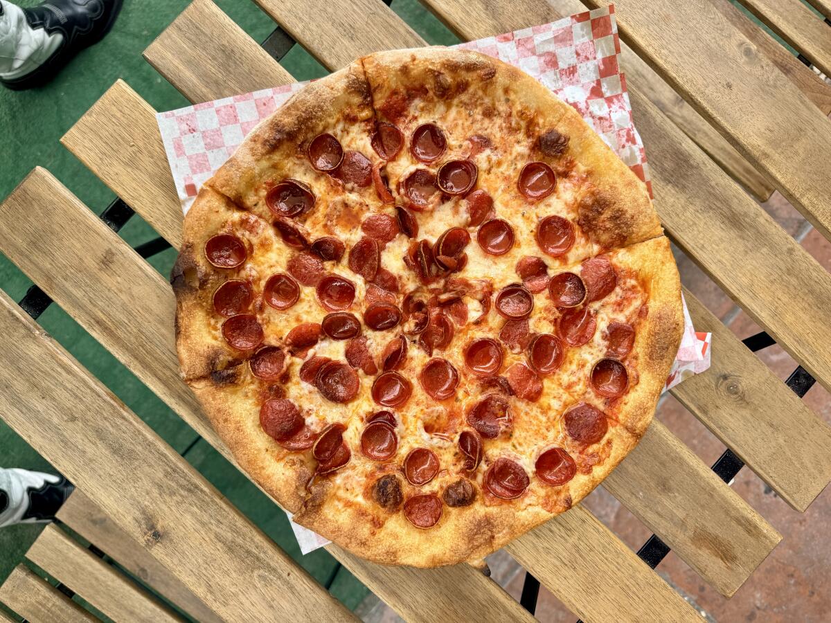 A New York-style pizza with double pepperoni cups from Pizza Cafe L.A. in Silver Lake.