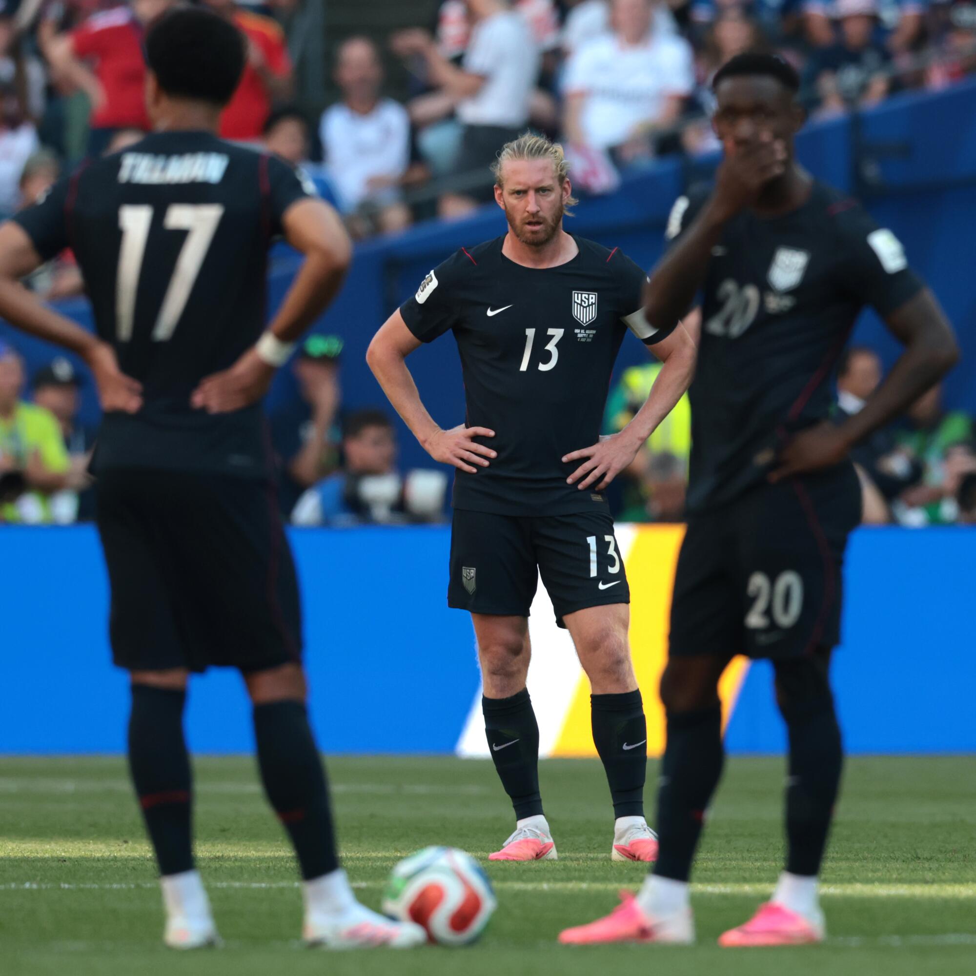 U.S. players Tim Ream, center, Malik Tillman, left, and Folarin Balogun react after Belgium’s third goal on Monday.