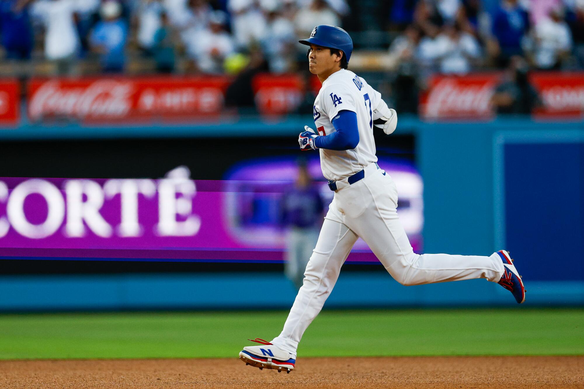 Dodgers star Shohei Ohtani rounds the bases after hitting a two-run home run.