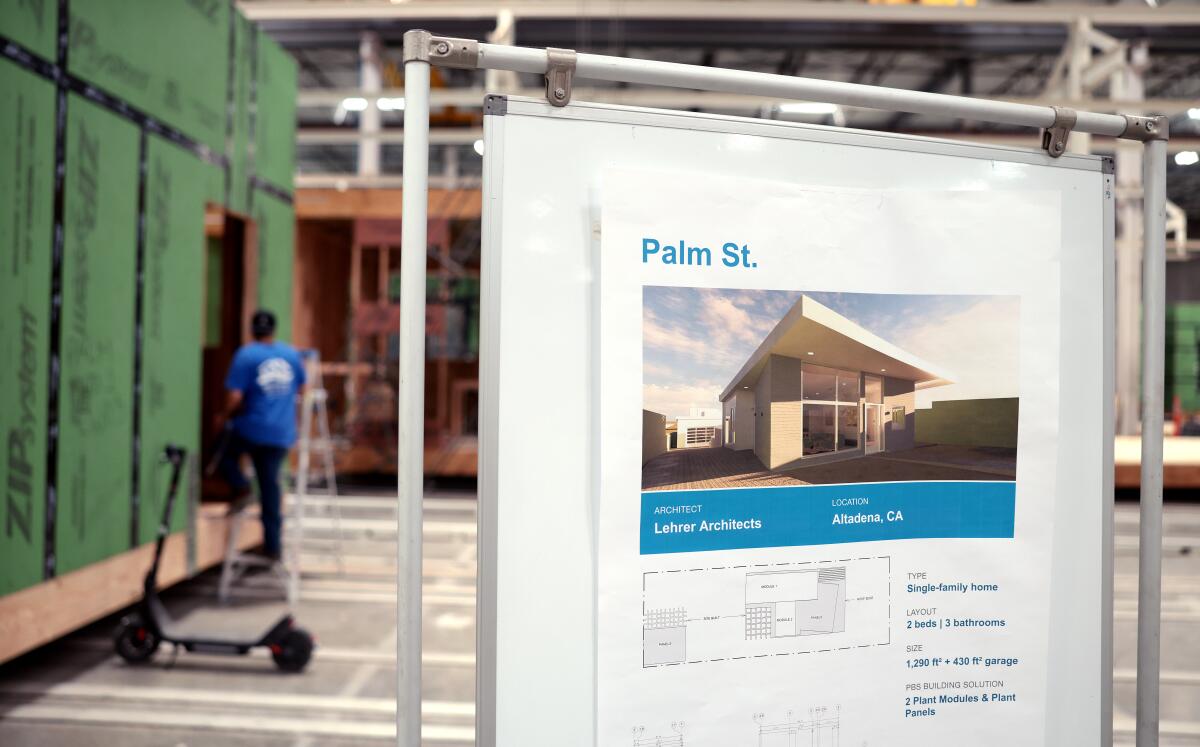 A sign shows an image of a home design