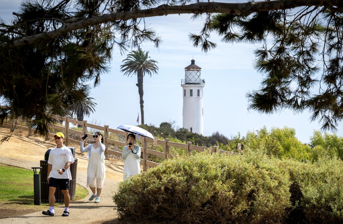 Visitors walk near the Point Vicente Lighthouse on Sept. 18, 2025.