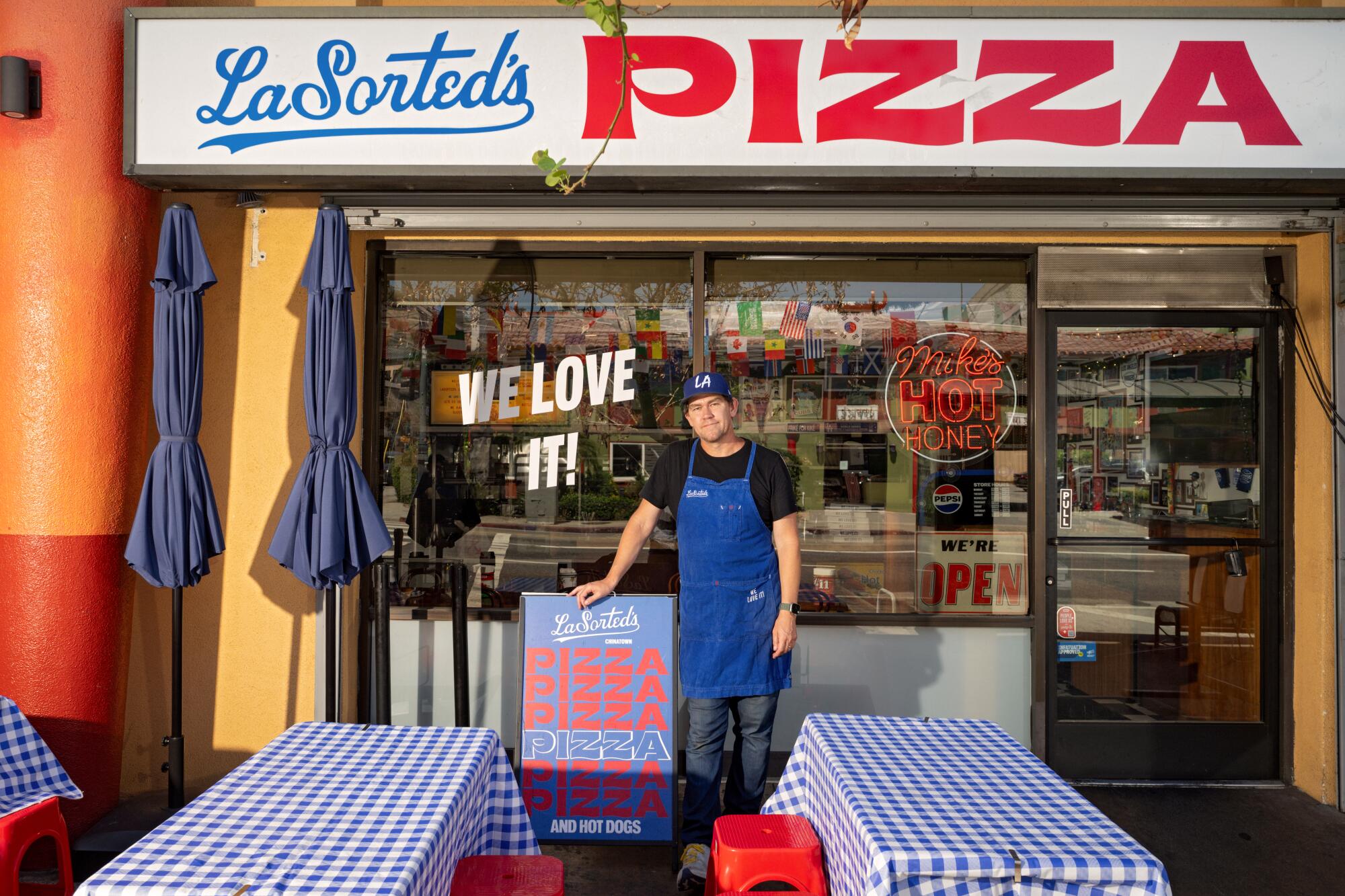 Tommy Brockert in front of his LaSorted's pizza and sandwich shop in Chinatown in Los Angeles.