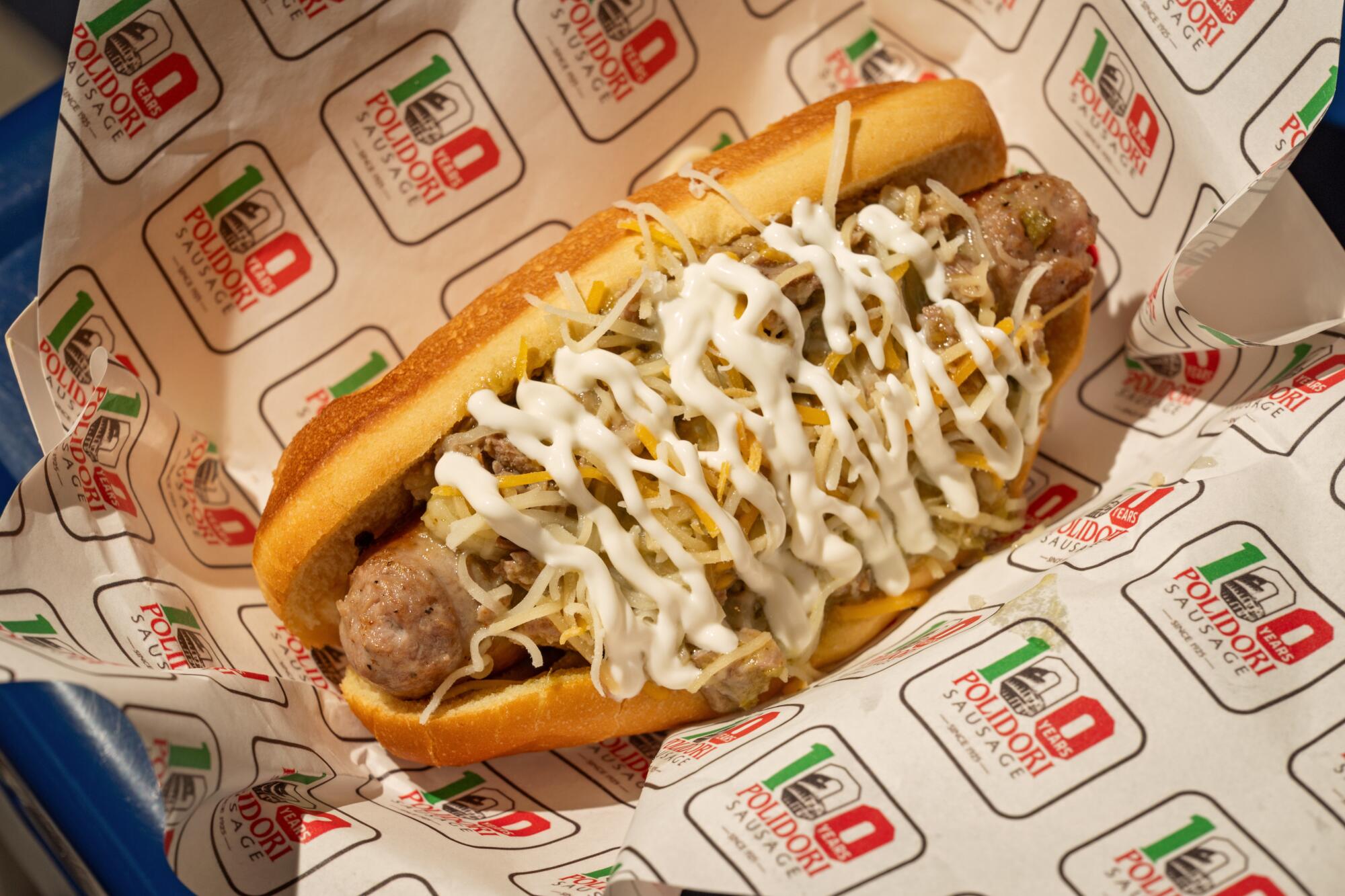 A Colorado Dog at LaSorted's, topped with chili verde and crema, in Los Angeles.